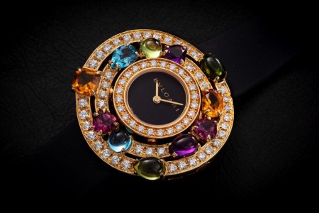 BULGARI ASTRALE CERCHI, AN IMPRESSIVE GOLD, DIAMOND AND GEMSTONES-SET QUARTZ WRISTWATCH